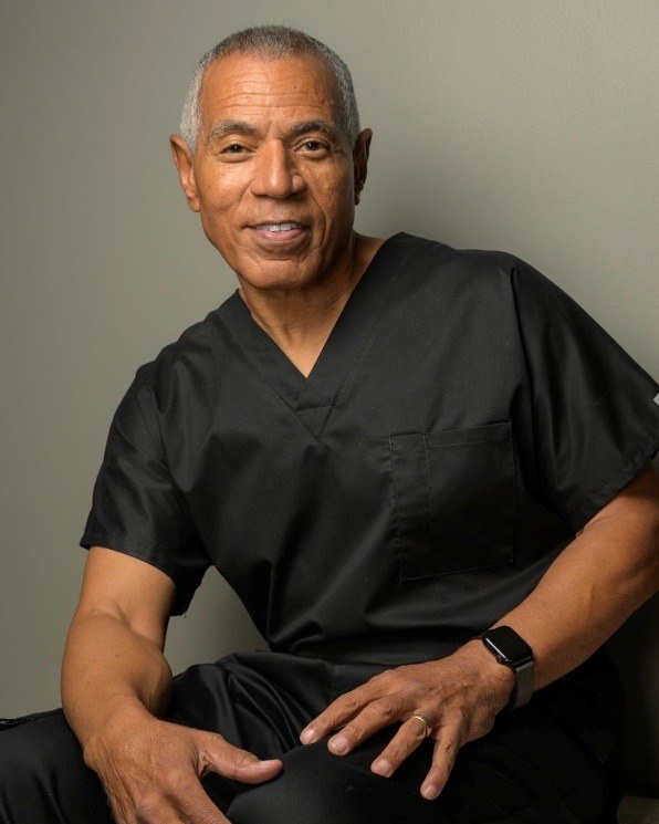 Dr. Al Jumper today, seated in surgical scrubs